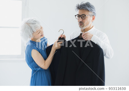 Gray-haired couple choosing clothes 93311630
