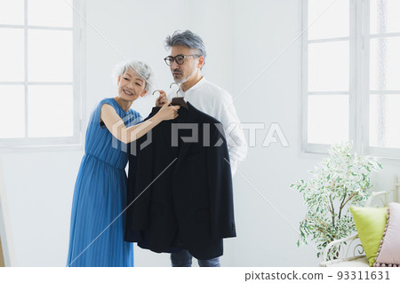 Gray-haired couple choosing clothes 93311631