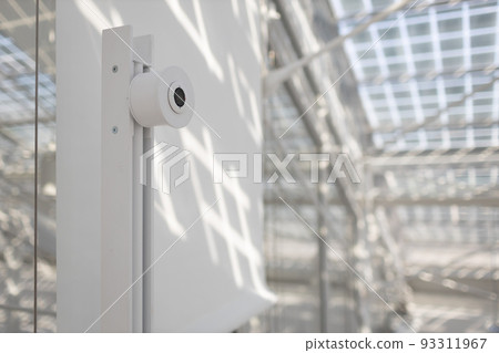 Face recognition system with camera in front of office in white interior indoor door 93311967