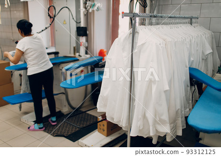 Dry cleaning shirts clothes. Clean cloth chemical process. Laundry industrial dry-cleaning. Dry cleaning shirts clothes. Clean cloth chemical process. Laundry industrial dry-cleaning. 93312125