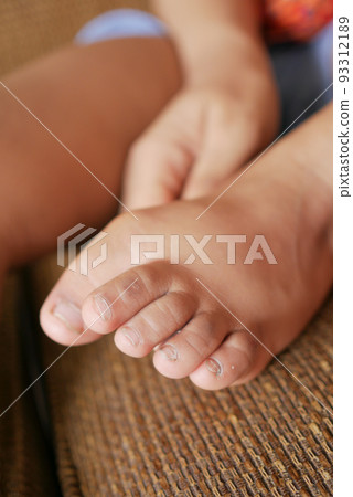 close up of 5 years old child dry feet on bed  93312189