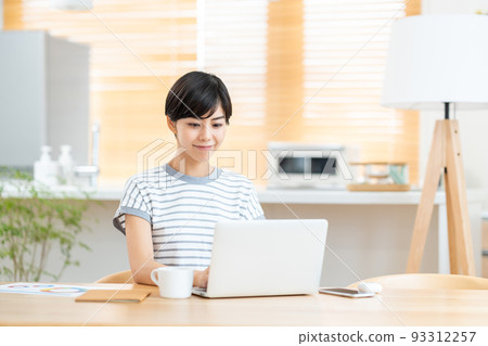 A woman doing telework in the living room 93312257