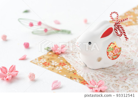 New Year's card for the year of the rabbit | Rabbit zodiac figurine and cherry blossoms New Year's card for the year of the rabbit | Rabbit zodiac figurine and cherry blossoms 93312541