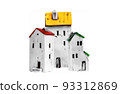 Miniature ceramic toy houses colorful roofs on a white 93312869