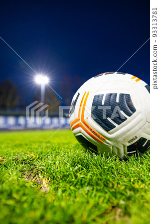 soccer ball on the lawn. football stadium at night. soccer ball on the lawn. football stadium at night. 93313781