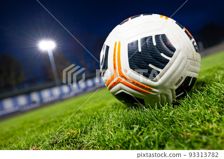 soccer ball on the lawn. football stadium at night. soccer ball on the lawn. football stadium at night. 93313782