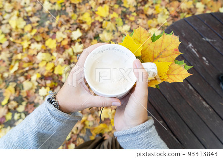 Autumn lifestyle with woman hands close up Autumn lifestyle with woman hands close up 93313843