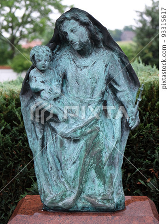 Virgin Mary with baby Jesus, cemetery in Ursberg, Germany 93315617