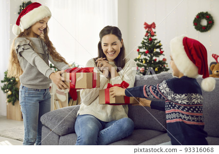 Cheerful Mother and Son with Christmas Gifts Stock Photo - Image