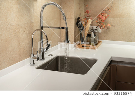 Minimalist kitchen with white countertop and sink Minimalist kitchen with white countertop and sink 93316874