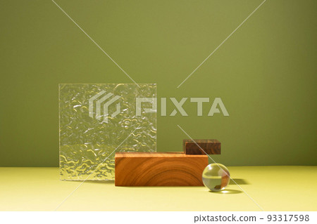 Creative abstract podium made of wooden figures and glass, dark green background hard light shadow 93317598