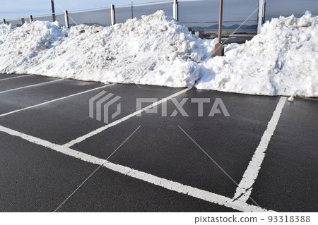 Parking lot in a snowy country where snow was removed 93318388