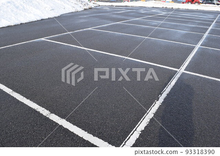 Parking lot in a snowy country where snow was removed 93318390