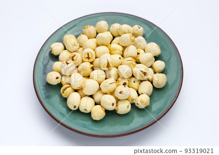 Dried lotus seeds on white background. 93319021