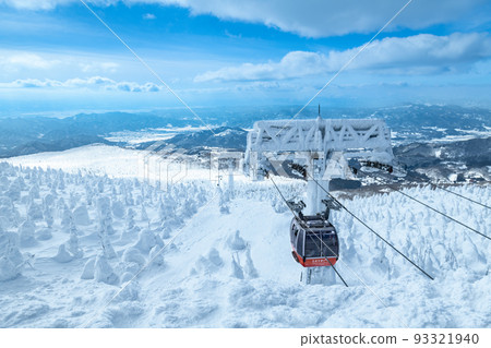 Snow covered trees and gondolas in the silver world of Zao, Yamagata 93321940
