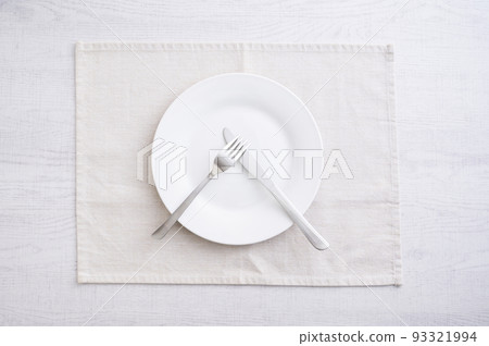 Simple white plate, fork and knife 93321994