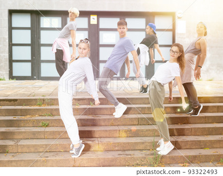 Group of dancing teenagers posing at street. Hip hop dancers 93322493