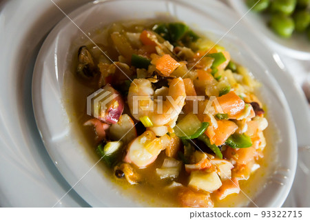 Dish of mediterranean cuisine, seafood stewed wit hvegetables and sauce Dish of mediterranean cuisine, seafood stewed wit hvegetables and sauce 93322715