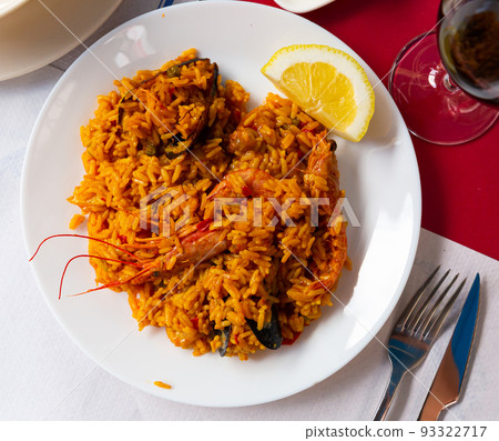 Typical spaish dish seafood paella with mussels, shrimps and rice Typical spaish dish seafood paella with mussels, shrimps and rice 93322717