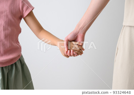 Parent and child holding hands front 93324648