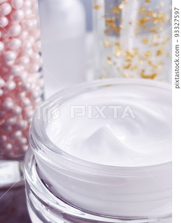 Skincare cosmetics, face cream moisturiser jar, golden serum emulsion bottles, beauty product close-up Skincare cosmetics, face cream moisturiser jar, golden serum emulsion bottles, beauty product close-up 93327597