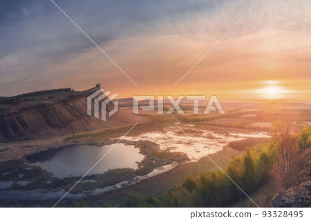 Panorama panoramic landscape nature mountains sunrise sunset of Chest butte or First Sunduk against blue sky. Sunduki mountain range from Devonian sandstone stone located in the valley of the Bely 93328495
