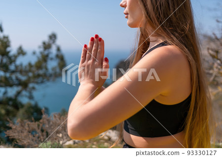 Young woman with long hair, fitness instructor in Sportswear Leggings and Tops, stretching before pilates, on a yoga mat near the sea on a sunny day, female fitness yoga routine concept Young woman with long hair, fitness instructor in Sportswear Leggings and Tops, stretching before pilates, on a yoga mat near the sea on a sunny day, female fitness yoga routine concept 93330127