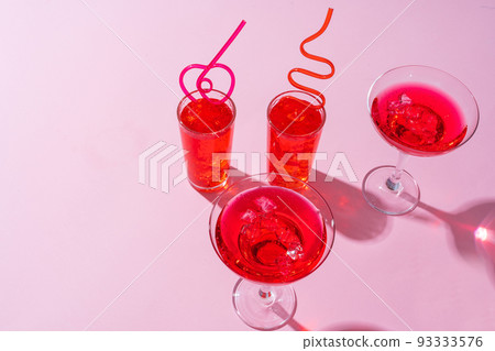 Pink summer cocktails on color background close up 93333576