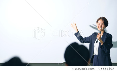 Women on stage and audience seminar presentation 93334192
