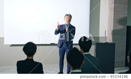 Men on stage and audience seminar presentation Men on stage and audience seminar presentation 93334196