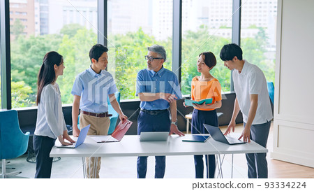 Cool Biz business group standing in the office for meetings Cool Biz business group standing in the office for meetings 93334224