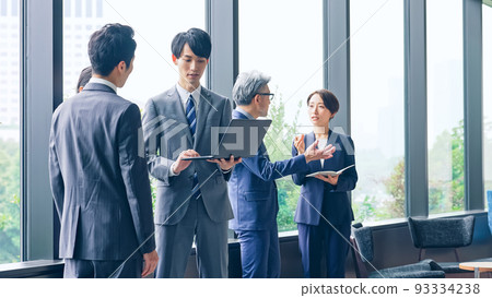 Business group talking in the lobby 93334238