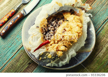 Fried sea bass with wild rice. 93336206