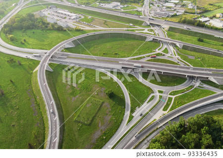 Aerial view of cars driving on round intersection in city, Transportation roundabout infrastructure, Highway road junction in Wroclaw, Poland 93336435