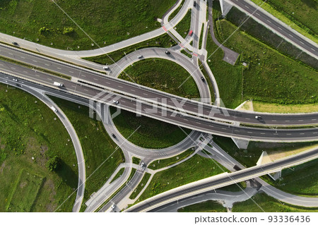Top view of cars driving on round intersection in city, Transportation roundabout infrastructure, Highway road junction in Wroclaw, Poland 93336436