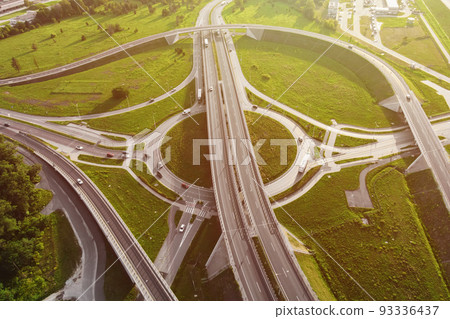 Aerial view of cars driving on round intersection in city, Transportation roundabout infrastructure, Highway road junction in Wroclaw, Poland 93336437