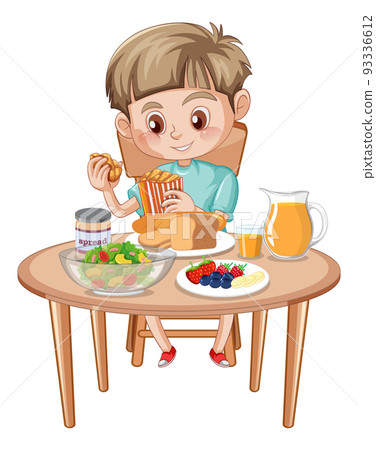 A boy having meal at the table 93336612