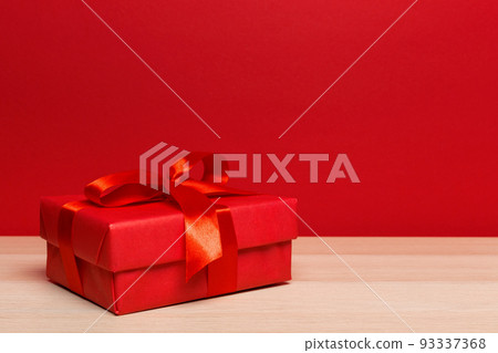 Christmas gift box on tablet Christmas gift box on tablet 93337368