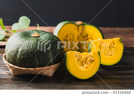 Green pumpkin on wooden background, Organic vegetable 93338460