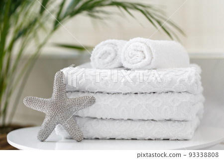Rolled white towels in the bathroom 93338808
