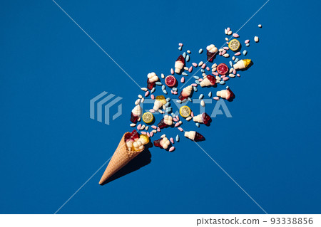 An image of a heap of jelly bean that is sprinkled from a waffle cone 93338856