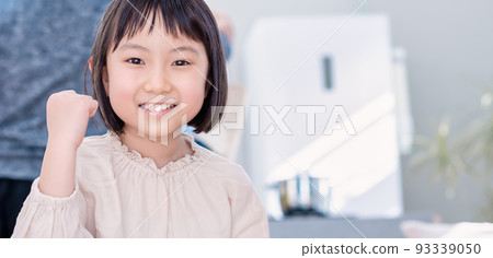 A close-up of a smiling elementary school student fist pump A close-up of a smiling elementary school student fist pump 93339050