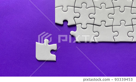 Jigsaw puzzle on purple background with customizable space for text or ideas. Copy space Jigsaw puzzle on purple background with customizable space for text or ideas. Copy space 93339453