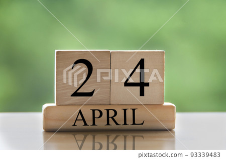 April 24 calendar date text on wooden blocks with blurred park background. Copy space and calendar concept April 24 calendar date text on wooden blocks with blurred park background. Copy space and calendar concept 93339483