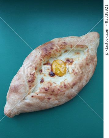 Georgian khachapuri bun with cheese and egg 93339921
