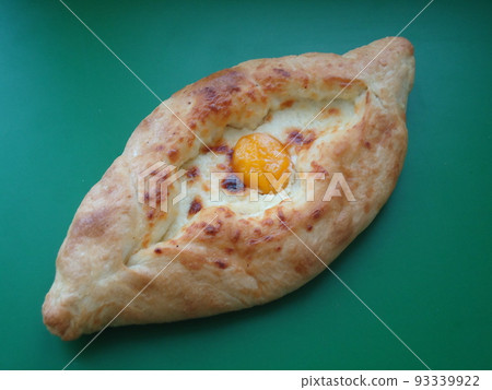 Georgian khachapuri bun with cheese and egg 93339922