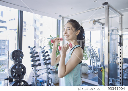 Young woman training in the gym Young woman training in the gym 93341004