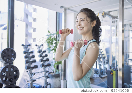 Young woman training in the gym Young woman training in the gym 93341006