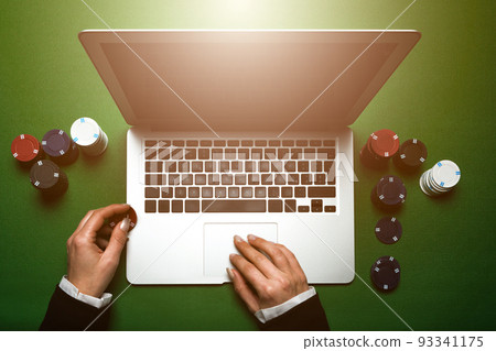 Top view of cropped woman hands using laptop for online casino. Concept virtual leisure activity. Top view of cropped woman hands using laptop for online casino. Concept virtual leisure activity. 93341175