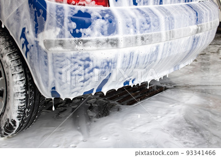 Part of the car in foam at the car wash Part of the car in foam at the car wash 93341466